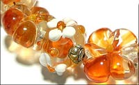 Набор стеклянных бусин лэмпворк (lampwork) «Оранжевые цветы»